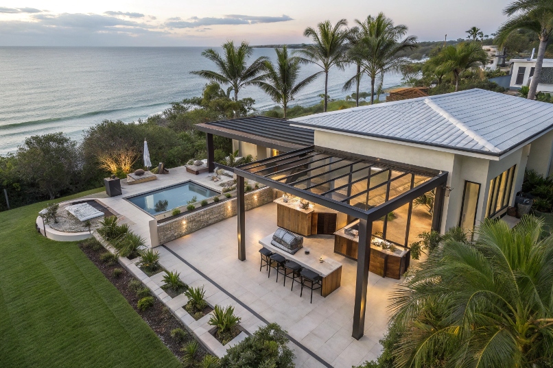 Aerial view of luxury Broadbeach home featuring integrated outdoor living area with coastal pergola, outdoor kitchen and entertaining space surrounded by tropical landscaping