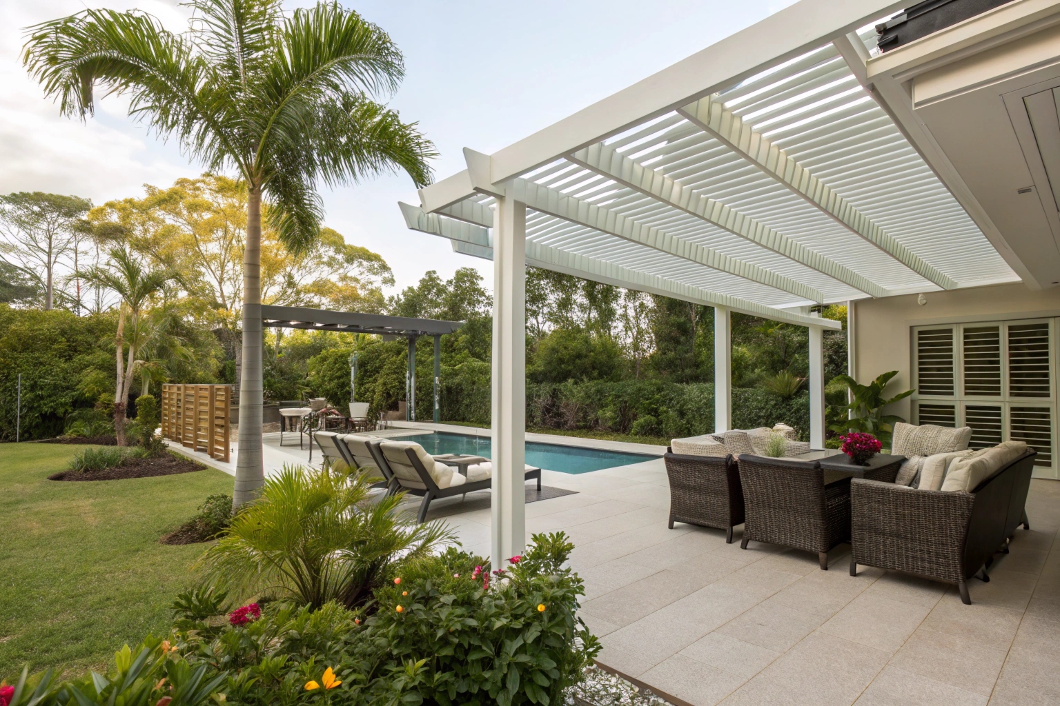 Modern aluminium privacy screens on pergola creating secluded Gold Coast outdoor living space
